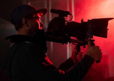 man-filming-with-professional-camera_23-2149066324
